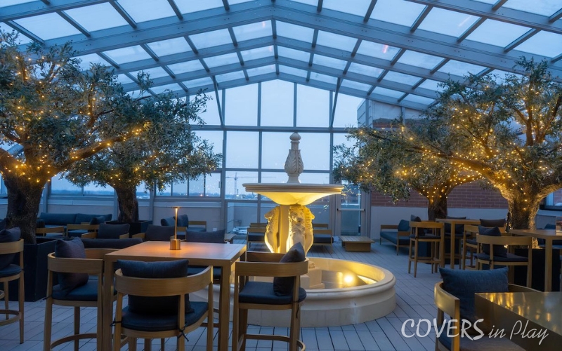 Interior view of restaurant bar roof enclosure in Chicago, Illinois in the evening