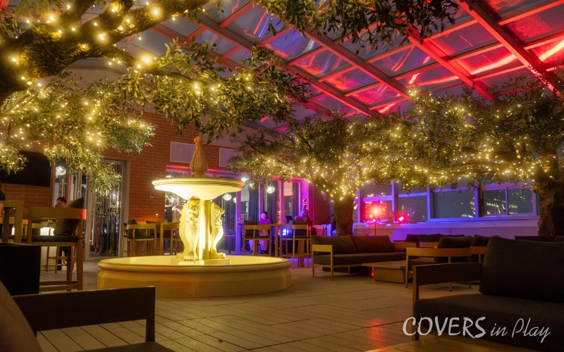 Interior view of restaurant bar roof enclosure in Chicago, Illinois at night