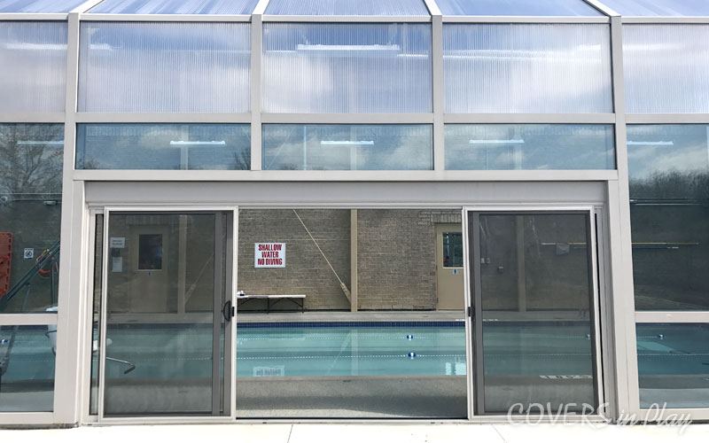 Close up of large sliding doors on pool enclosure at Montessori school in Mississauga.