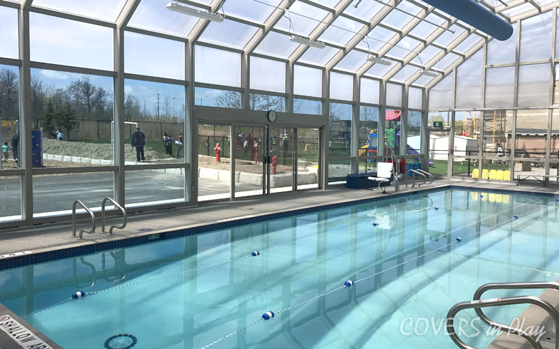 Interior of pool enclosure in Mississauga, showing the large sliding doors closed to shield from the elements.