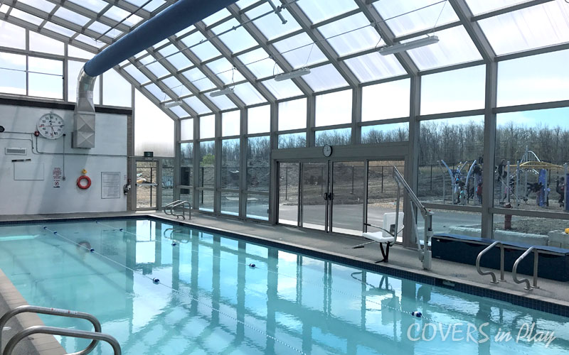 Interior of commercial pool enclosure in Mississauga, showing the natural light entering the space.