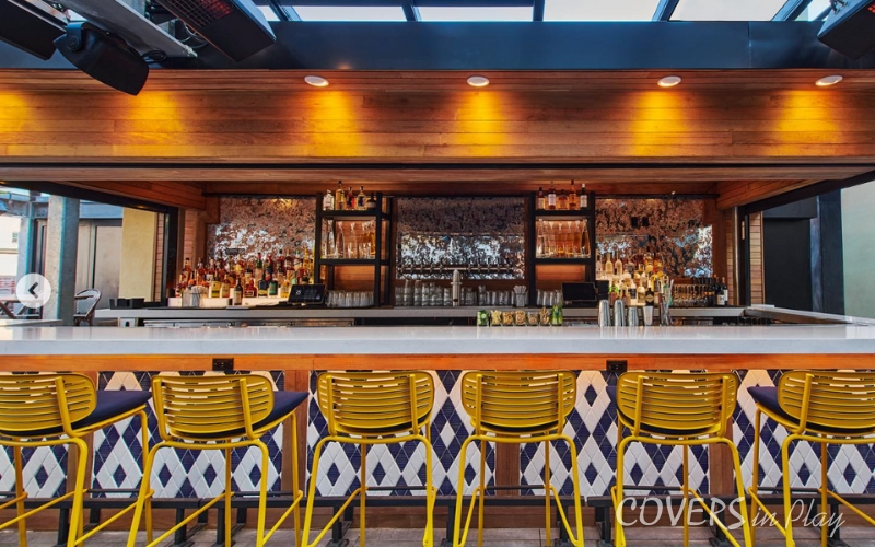 Interior view of restaurant bar enclosed with roof enclosure in New York, NY