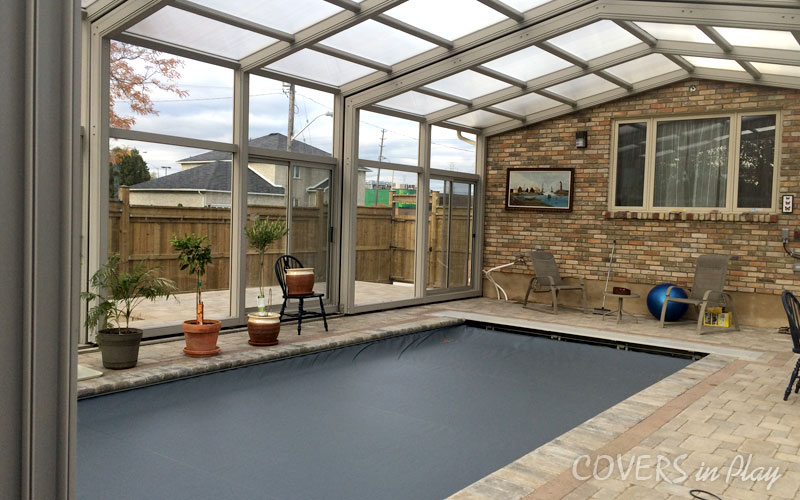Inside view of a closed pool enclosure with clear acrylic panels in Burlington