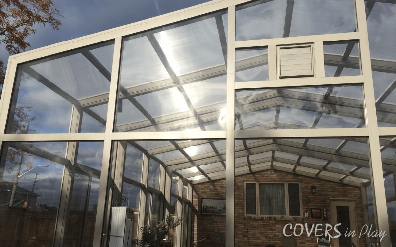 Alternate angle of outside rear view of a closed pool enclosure in Burlington