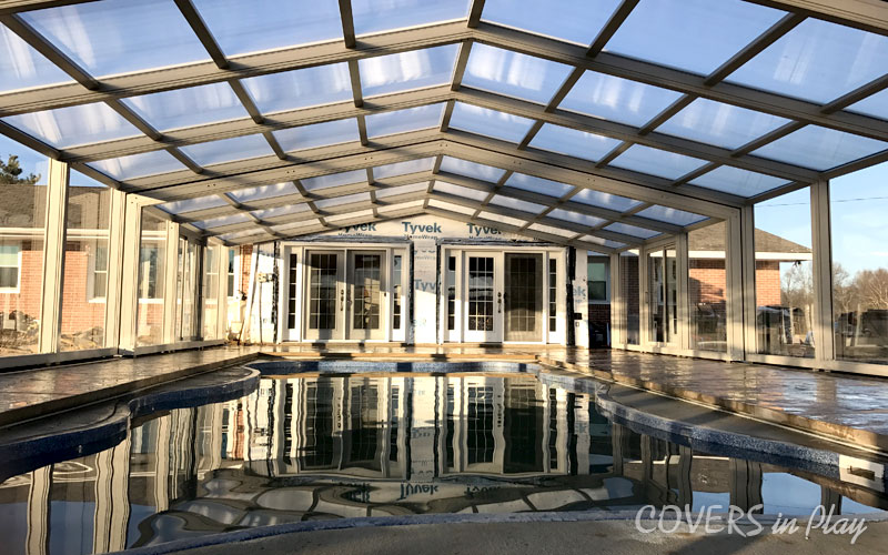 Closed pool enclosure attached to a house in Clayton