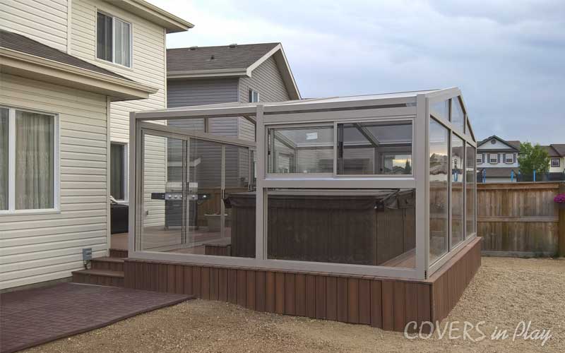 Rear Side-angled exterior view of a fixed hot tub enclosure in Fort Saskatchewan