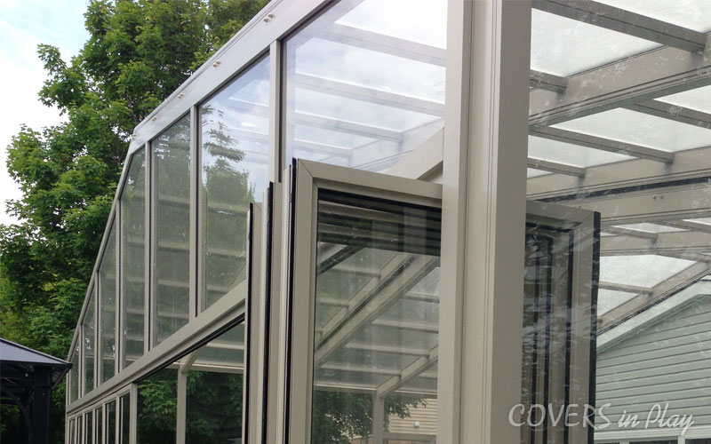 Alternate rear exterior close-up view of closed retractable pool cover in Holland Landing