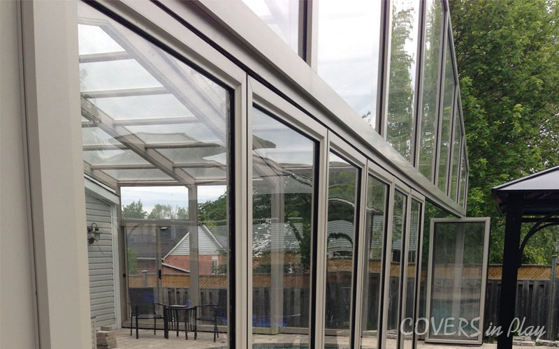 Rear exterior close-up view of closed retractable pool cover in Holland Landing