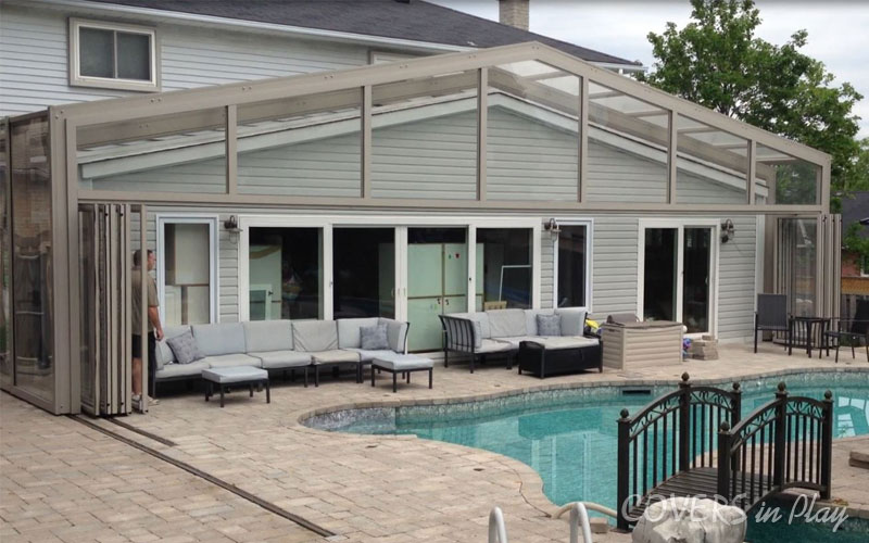 Exterior side angled view of opened retractable swimming pool dome in Holland Landing
