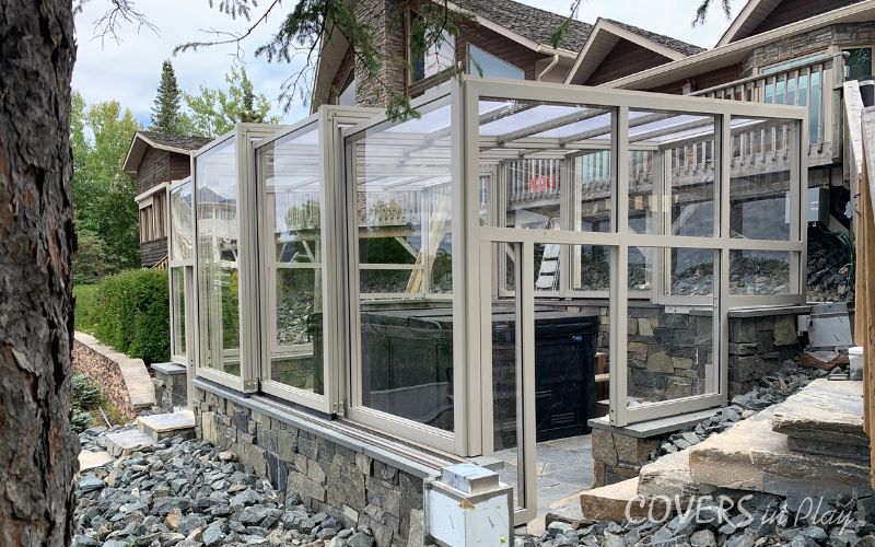 Exterior angled view of retractable swim spa enclosure in Kenora, ON