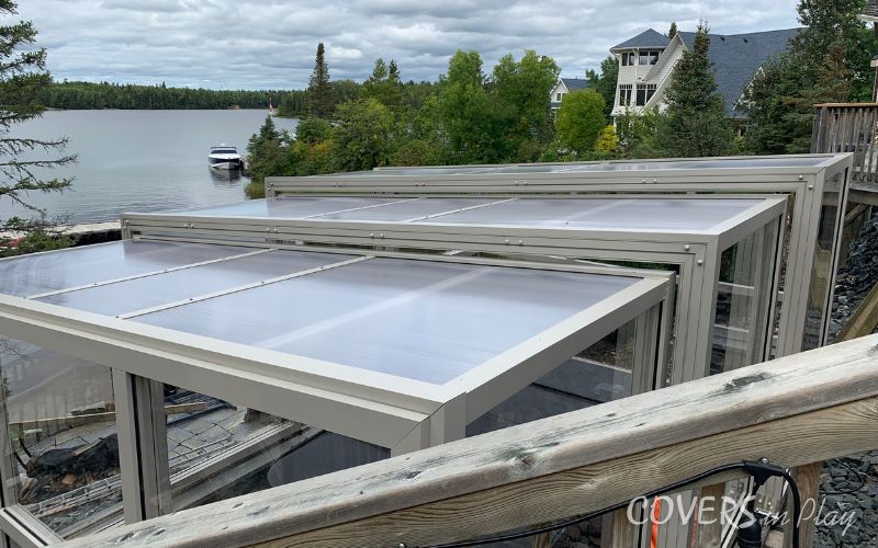 Exterior angled view of swim spa enclosure on waterfront in Kenora, ON