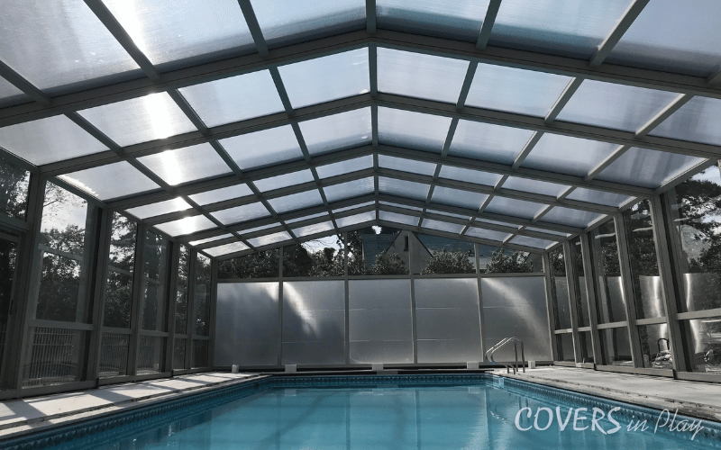 Front interior view of closed residential pool dome in Lakewood backyard