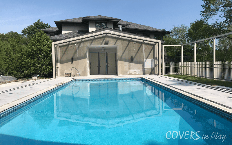 An interior rear view of an opened retractable pool dome in Lakewood