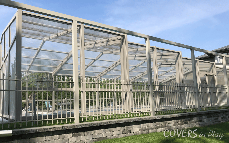 An alternative exterior side view of closed retractable pool enclosure in Lakewood