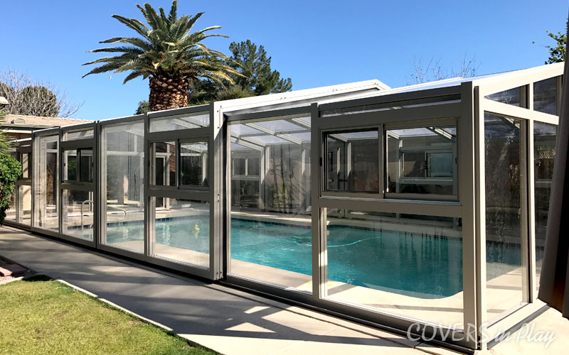 Side exterior view of closed residential pool enclose cover in Mesa residential home