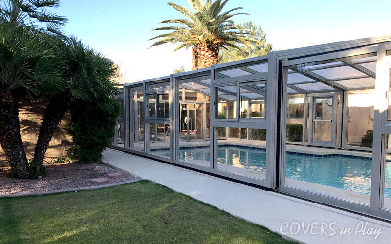 Side exterior view of closed residential pool dome cover in Mesa