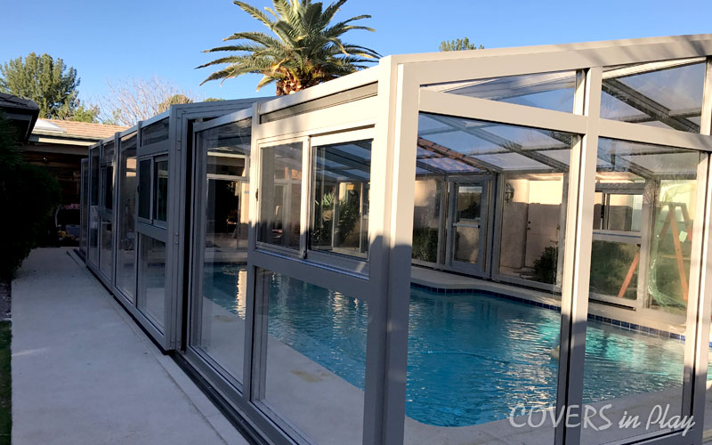 Side exterior view of closed pool enclosure in Mesa residential home