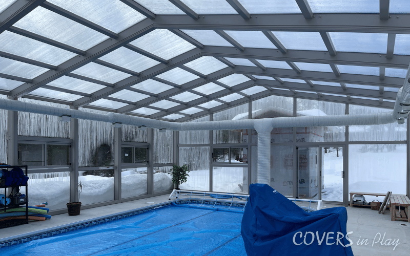 Interior side view of pool enclosure in Minden, showing the heating ventilation system for winter use