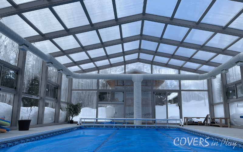 Interior rear view of pool enclosure in Minden, showing the natural light flowing through the structure