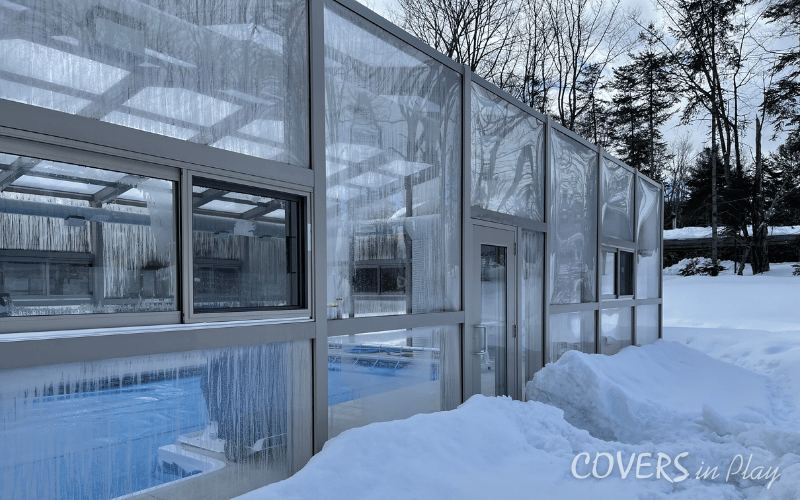 Side exterior view of pool enclosure in Minden, showing the versatile windows and doors