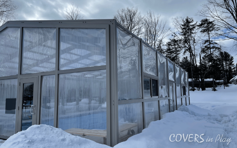 Exterior side angle view of pool enclosure in Minden, ON, showing the clear acrylic walls