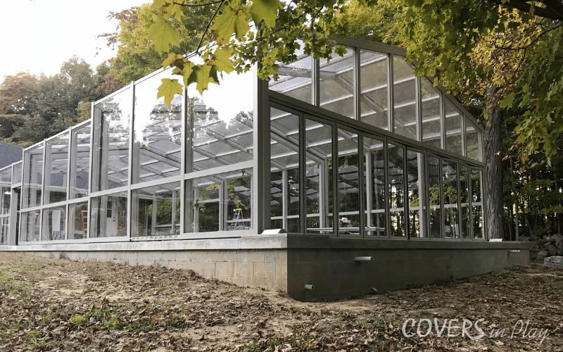 Rear angled view of residential pool dome in Paris backyard