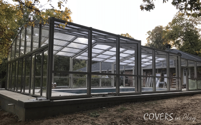 Side rear angled exterior view of a pool dome in Paris