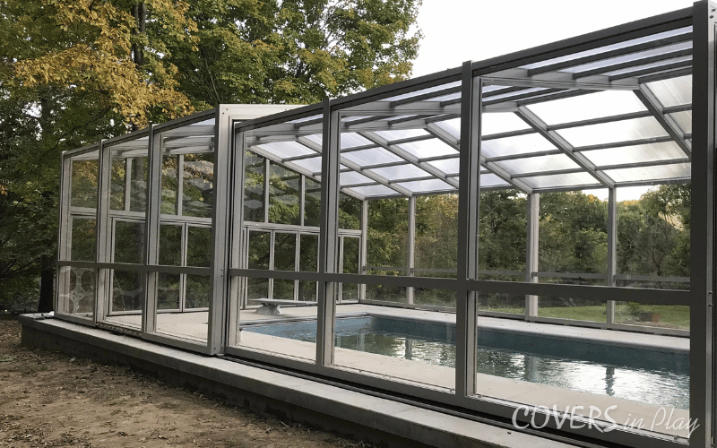 Side-angled view of residential swimming pool enclosure in Paris backyard