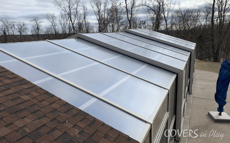 Exterior above angled view of closed pool enclosure