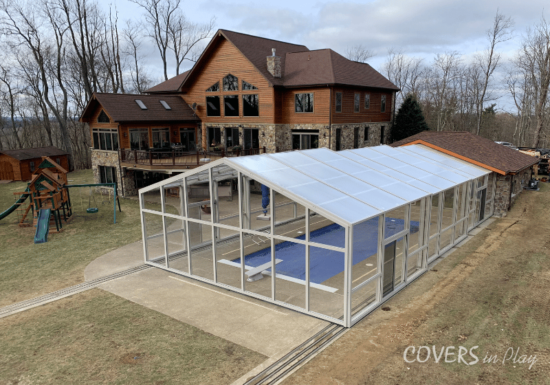 Exterior elevated angled rear view of closed pool enclosure