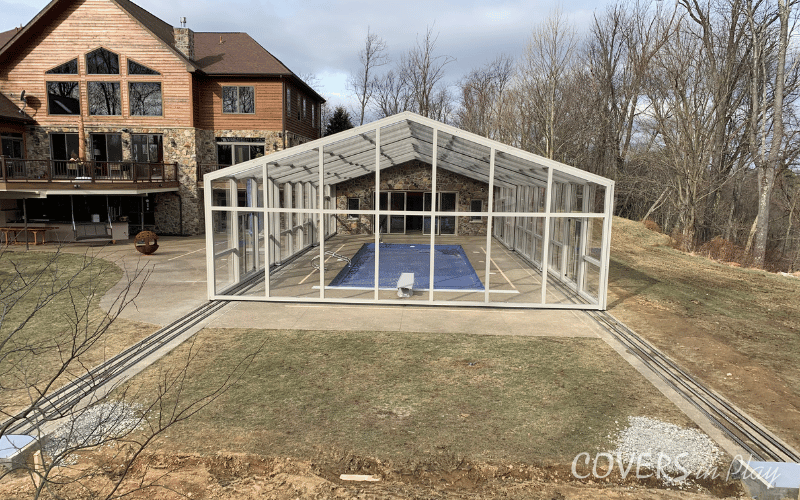 Exterior elevated rear view of closed pool enclosure