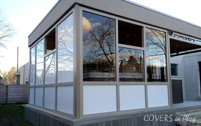 Rear exterior view of swim spa enclosure in Port Credit, showing the versatile tinted and frosted acrylic for additional privacy.