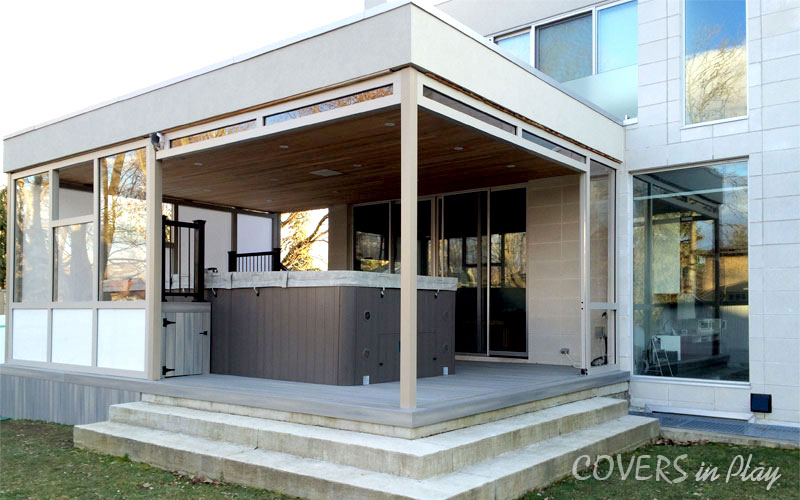 Exterior wide view of swim spa enclosure with bi-fold doors open in Port Credit, ON