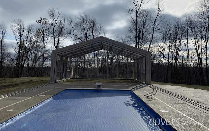 Exterior front view of large backyard pool enclosure