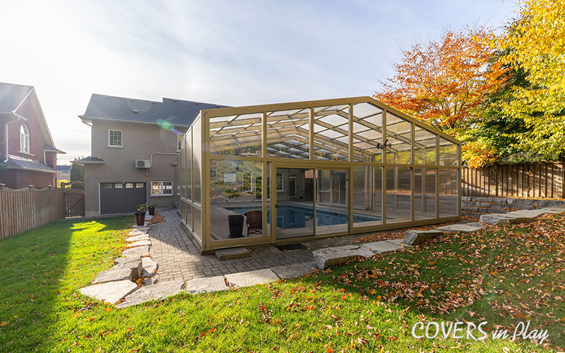 Rear view of closed pool enclosure attached to a house in Whitby
