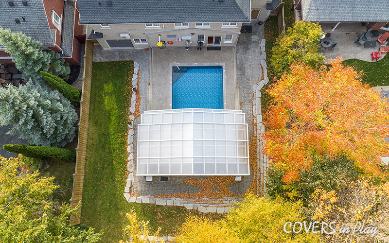 Top view of opened pool enclosure attached to a house in Whitby in the fall