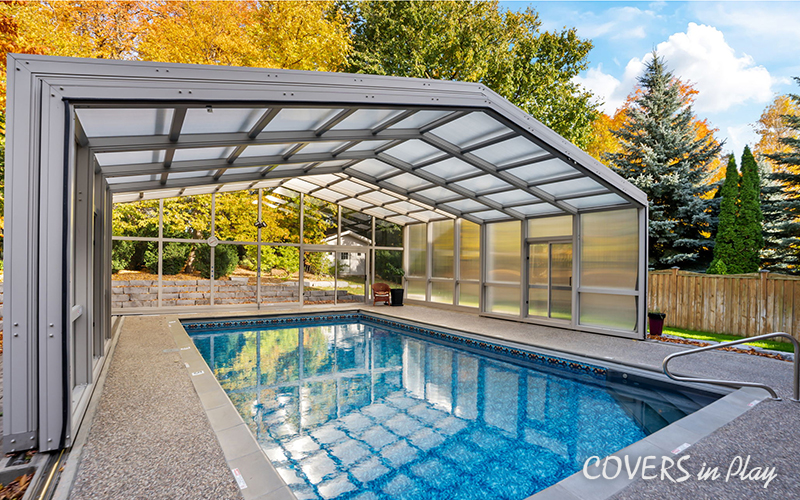 Exterior angled view of opened pool enclosure with frosted windows in Whitby