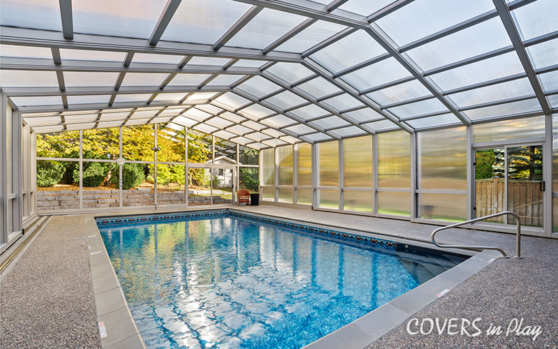 Side angle of closed pool enclosure with frosted windows in Whitby