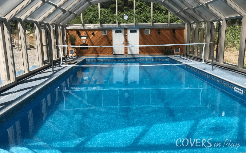 Center view of closed pool enclosure with volleyball net in BC