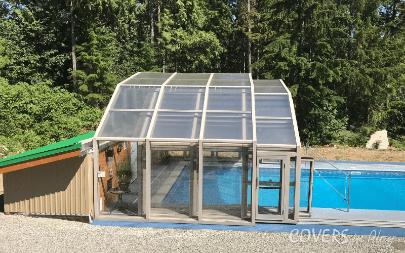 Side view of open pool enclosure attached to pool house in Mission, BC