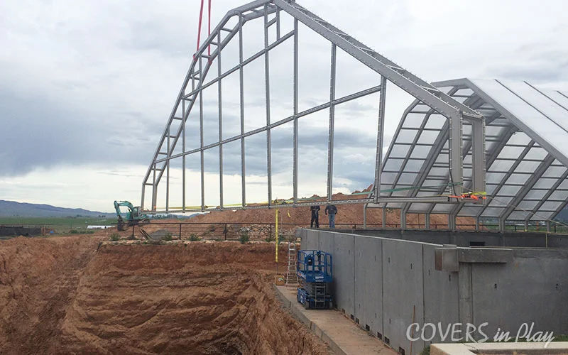 Exterior rear view of the construction of swimming pool dome in Nephi, UT