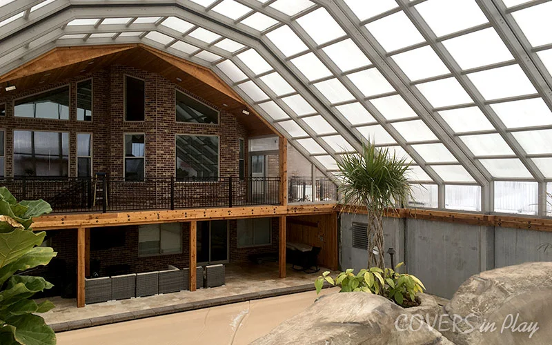 Interior angled view of residential pool dome attached to a house in Nephi, UT